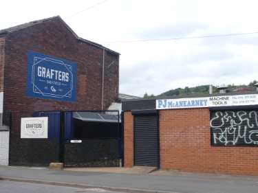 Burton Road showing (left) Grafters, bar and (right) No. 54 P. J. McAnearney, machine tools 