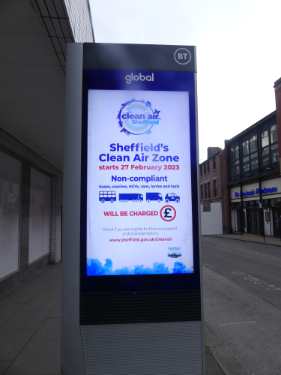 Electronic advertising hoarding on Cambridge Street showing information on Sheffield's Clean Air Zone
