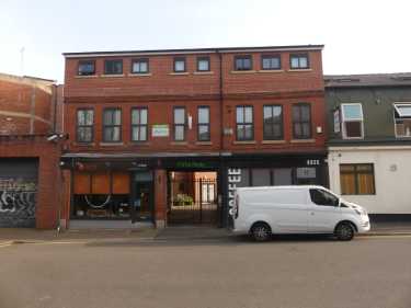 Cemetery Road showing (left) No. 7 Tabby Teas, cat cafe and (right) No. 11 Husk, coffee shop