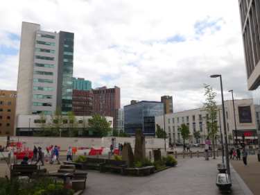 Cambridge Street pedestrianised area looking towards Pinstone Street and The Moor showing (top left) Homes for Students Redvers Tower (formerly Redvers House, offices) and (bottom right) H and M, fashion store, No. 1 The Moor