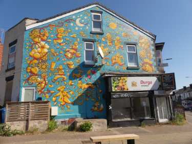 Mural by The Tribes above former Durga Stores, No. 388 Abbeydale Road and junction with (left) Empire Road
