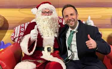 Councillor Ben Miskell, Chair of the Transport, Regeneration and Climate Policy Committee at Sheffield City Council with Father Christmas