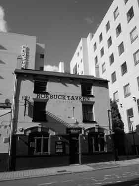 Roebuck Tavern, No. 72 Charles Street showing (left) Derwent House, offices and (right) the rear of Howden House, Sheffield City Council offices, c.2023