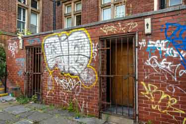 Graffitied closed ladies and gentlemen's public toilets in front of Highfield Library, London Road 