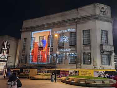 Light show projecting Pete McKee art work onto the Central Library, Tudor Square