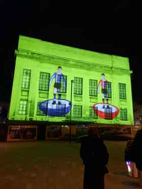 Light show projecting Pete McKee art work onto the Central Library, Tudor Square