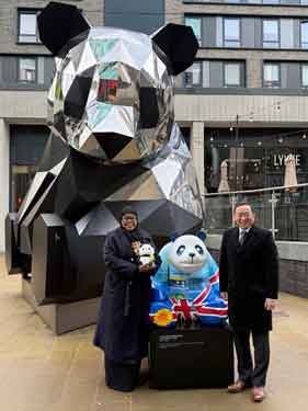 The Chinese Consul General from the Manchester Consulate, Tang Rui, presenting the Lord Mayor of Sheffield, with a panda statue on behalf of Chengdu City Government