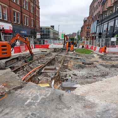 Works on Pinstone Street revealing original tram tracks