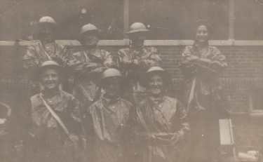 Sheffield ARP Ambulance Service officers, wearing gas protection coats, at Hartley Brook School Depot, Sheffield