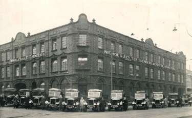 Premises of Nichols and Co. (Sheffield) Ltd., wholesale grocers and tea, coffee and fruit merchants, Shalesmoor (on corner with Shepherd Street), Sheffield, with motor lorries parked outside, [late 1930s]