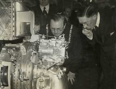 Lord Mayor, Councillor Samuel Hartley Marshall JP with Lord Harwood (Henry George Charles Lascelles, 6th Earl of Harewood (1882 - 1947) examining a supercharged aeroplane engine at the Ministry of Supply, Fargate House, Nos 19 - 23 Fargate