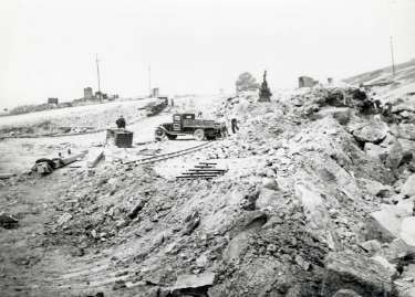 Working on the Broomhead reservoir during the construction of the Ewden Valley reservoirs