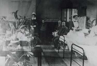 Mens ward, City General Hospital (later known as the Northern General Hospital), Fir Vale showing (centre back) Miss Amelia Lawson, matron, c. 1920