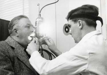 Doctor examining a patient, Royal Hallamshire Hospital, Glossop Road