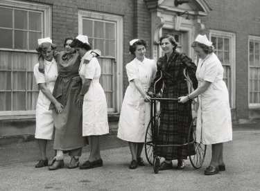 Nurses helping patients to walk, probably School of Physiotherapy, Westbourne [House], Collegiate Crescent