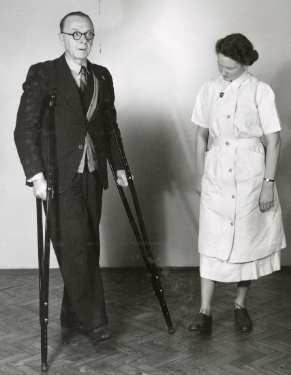 Nurse with patient on crutches, probably School of Physiotherapy, Westbourne [House], Collegiate Crescent
