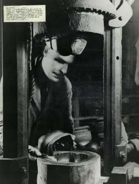 Stamping out fancy patterns at Walker and Hall Ltd., Electro Works, junction of Howard Street and Eyre Street