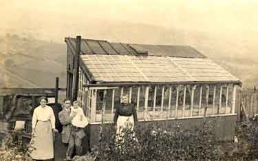 Unidentified group outside their greenhouse possibly in Walkley 