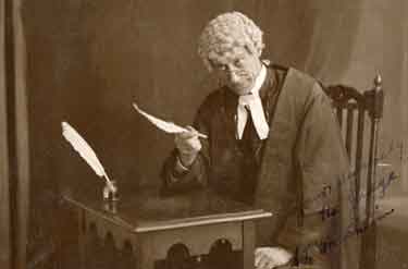S. L. Critchison, actor, playing the part of a judge