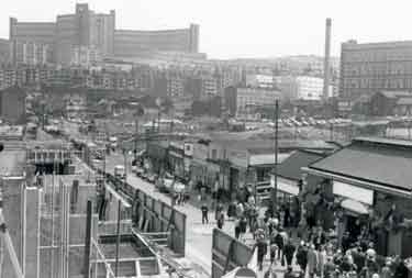 View showing old Sheaf Market (Rag an' Tag), Broad Street (right), construction of Sheaf Market (left), Hyde Park Flats (rear centre) and Park Hill Flats (far right).
