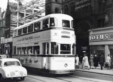 Tram 513 on Fargate showing (right) No. 21 Eagle Star Insurance Co., Fargate House and (right) No. 23 Lotus and Delta Ltd., shoe dealers