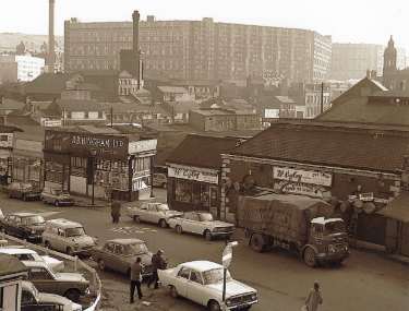 Shops on Broad Street showing (l.to r.) Granelli's, confectioners and ice cream makers; R. B. Bingham, provision merchants and W. Ogley, pet shop, (back) Park Hill Flats