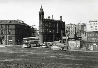 Commercial Street from Sheaf Street showing (centre) Wheel Hill and Electricity Supply Offices, (right) Commercial Street Bridge, Barclays Bank and Turners Tool Stores Ltd.