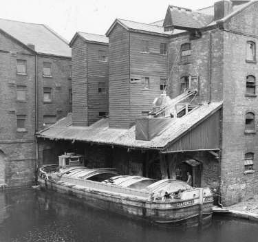 Canal barge, 'Clarence T.', moored under the Grain Warehouse, Canal Basin