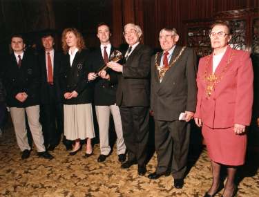 Handing over of the Torch for the World Student Games in Sheffield showing (2nd right) the Lord Mayor, Councillor James Moore and (1st right) Lady Mayoress, Mrs Sheila Moore