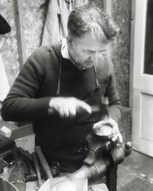 Derek Hinchsliffe, flat hammerman at Draper and Lamb, silversmiths, No.2 Newton Lane
