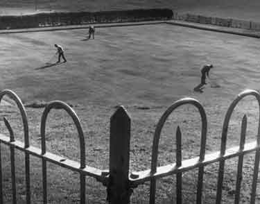 Raking a bowling green at Manor Community Centre, junction of Hastilar Road and Prince of Wales Road