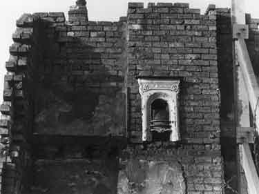 Fireplace and mantlepiece in a building undergoing demolition