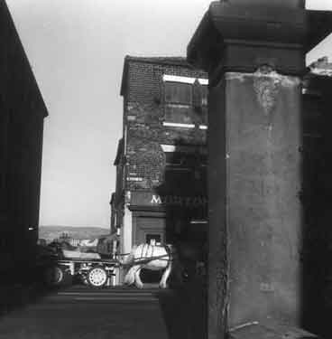 Horse and cart passing Mortons cutlers, Nos. 100 - 104 West Street and junction with (left) Bailey Lane