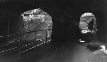 Road and footpath under Worksop Road railway bridge and canal aqueduct