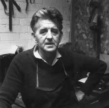 Derek Hinchsliffe, flat hammerman, in his work shop at Draper and Lamb, silversmiths, No. 2 Newton Lane
