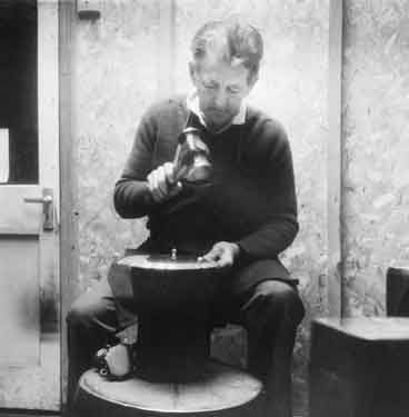 Derek Hinchsliffe, flat hammerman at Draper and Lamb, silversmiths, No.2 Newton Lane