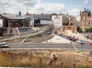 Supertram construction on (centre) Commercial Street and Park Square showing (left) Ponds Forge and (centre) Barclays Bank, c. 1992