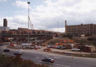 Construction of Supertram bridge on (left) Park Square showing (foreground) Sheaf Street, (centre right) Park Hill Flats and (centre left) Bard Street Flats, c. 1992