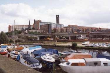 View from Victoria Quays of construction of Supertram bridge on (centre) Parkway and Park Square showing (back centre) Hyde Park and Bard Street Flats, c. 1992
