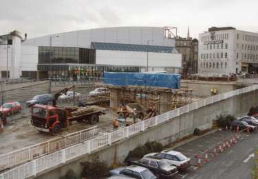 Construction of Park Square Supertram Bridge on Commercial Street showing (top left) Ponds Forge International Sports Centre and (top right) Barclays Bank