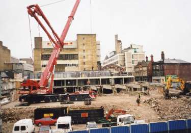 Demolition of Sheaf Market showing (back left) rear of Wilkinson Home and Garden Stores, Haymarket and (right) Exchange Street