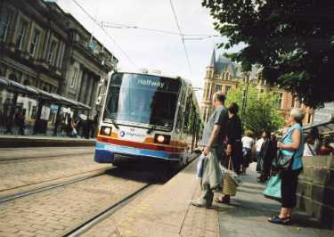 Supertram No. 101 at the Cathedral tram stop, Church Street showing (left) No. 5 Royal  Bank of Scotland and the Cutlers Hall