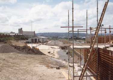 Construction of Nunnery Supertram Depot, off Woodbourn Road with (back left) Hyde Park Flats 