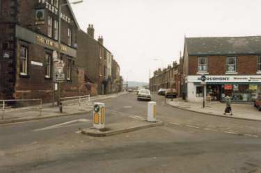 Junction of Loxley Road (foreground) and (centre) Loxley New Road showing (right) Autoconomy, motorists discount shop, No. 10 Loxley Road and (left) The Yew Tree Inn