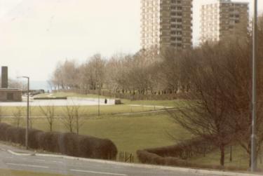 Playing fields of Herdings School (latterly Woodlands Primary School) off Norton Avenue showing (top right) Herdings Tower Blocks, Raeburn Road 