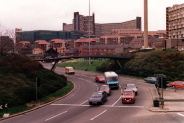 Park Square roundabout at the junction with (right) Sheaf Street showing (back) Hyde Park Flats