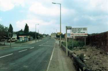 Mansfield Road showing (left) the bus terminus and (right) advertising boards for a new housing estate on Wadsworth Road