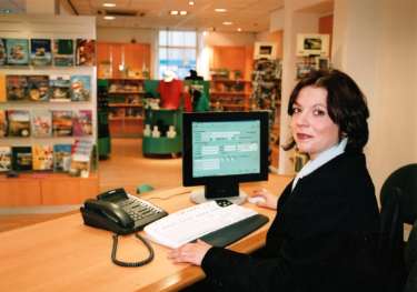 Member of staff at the Visitor Information Centre, Nos. 67 - 69 Tudor Square