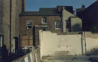 Demolition at the back of Cutler's Hall at Exchange Gateway, showing caretaker's house for Cutlers Hall