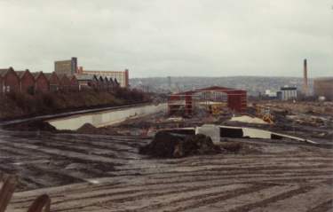 Factory development alongside the Sheffield and South Yorkshire Navigation showing (centre left) Hyde Park Flats